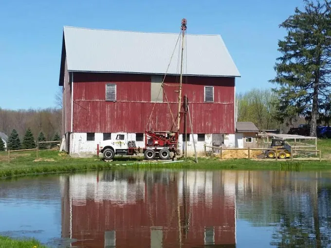A barn beside a pond in the rural communities Chatfield serves