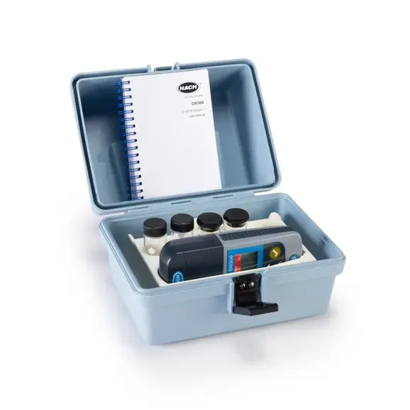 Hach DR300 colorimeter in an open blue carrying case with sample vials and a manual