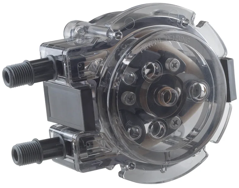 Clear Stenner QuickPro pump head with its roller assembly and two fittings